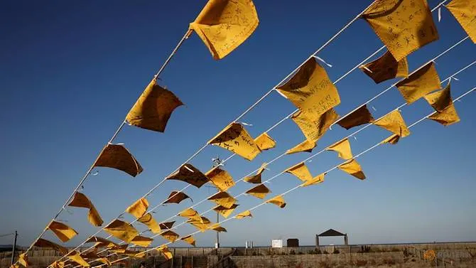 Japan mourns lives lost in earthquake and Fukushima disaster 10 years ago 4727-yellow-handkerchiefs-with-messages-supporting-people-in-areas-hit-by-the-2011-earthquake-and-tsunami-are-hanged-ahead-of-the-10th-anniversary-of-fukushima-disaster-in-iwaki-1